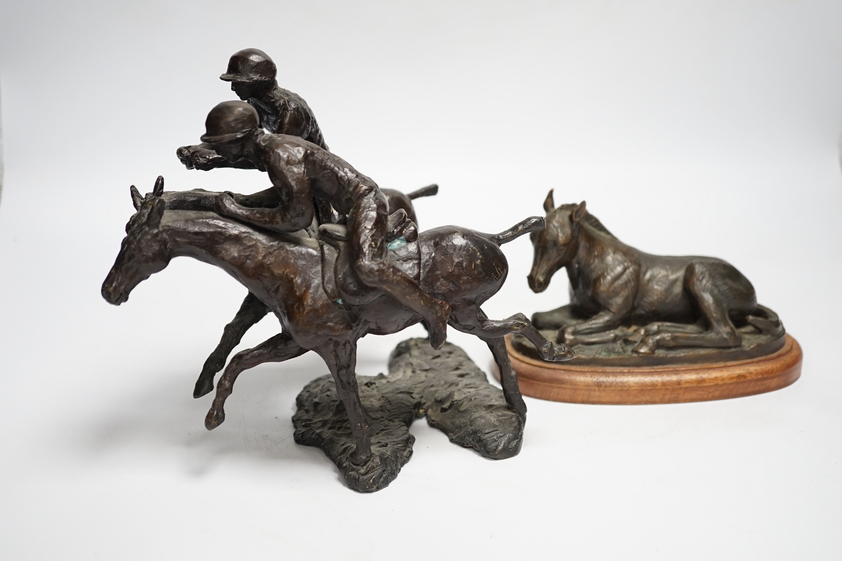 A group of metalware including two jardinieres, two brass dishes, a brass horses, head tray, a bronze of two jockeys on horseback and a bronze of a seated horse, tallest jardiniere 29cm